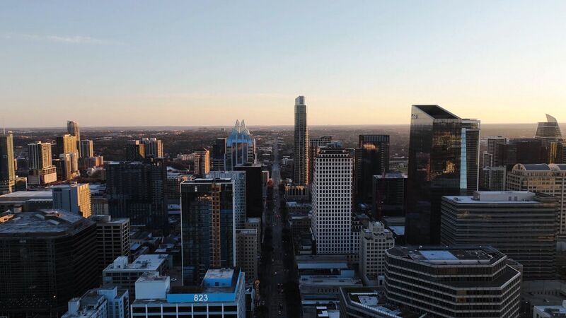 Downtown Austin skyline at dusk from altitude